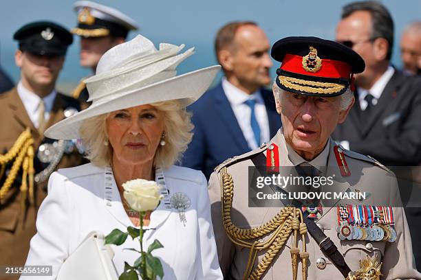 Britain's Queen Camilla and Britain's King Charles III attend the UK Ministry of Defence and the Royal British Legion's commemorative ceremony...