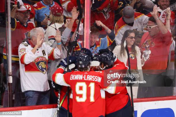 Vladimir Tarasenko of the Florida Panthers celebrates with teammates after his goal against the New York Rangers during the third period in Game Six...