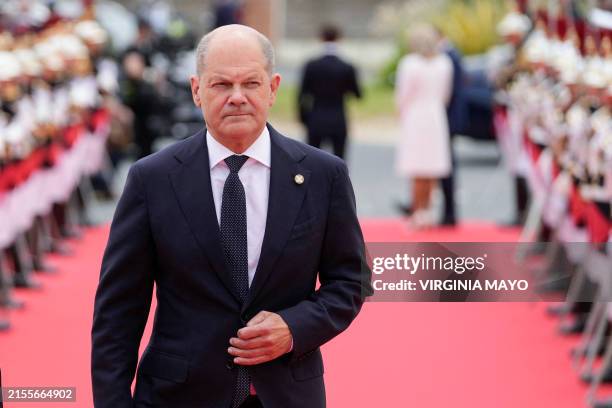 German Chancellor Olaf Scholz arrives to attend the International commemorative ceremony at Omaha Beach marking the 80th anniversary of the World War...