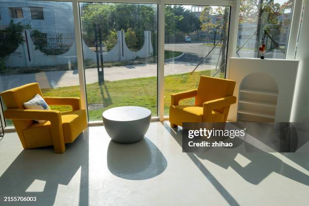 sunny indoor sofa and coffee table - rest stop interior stock pictures, royalty-free photos & images