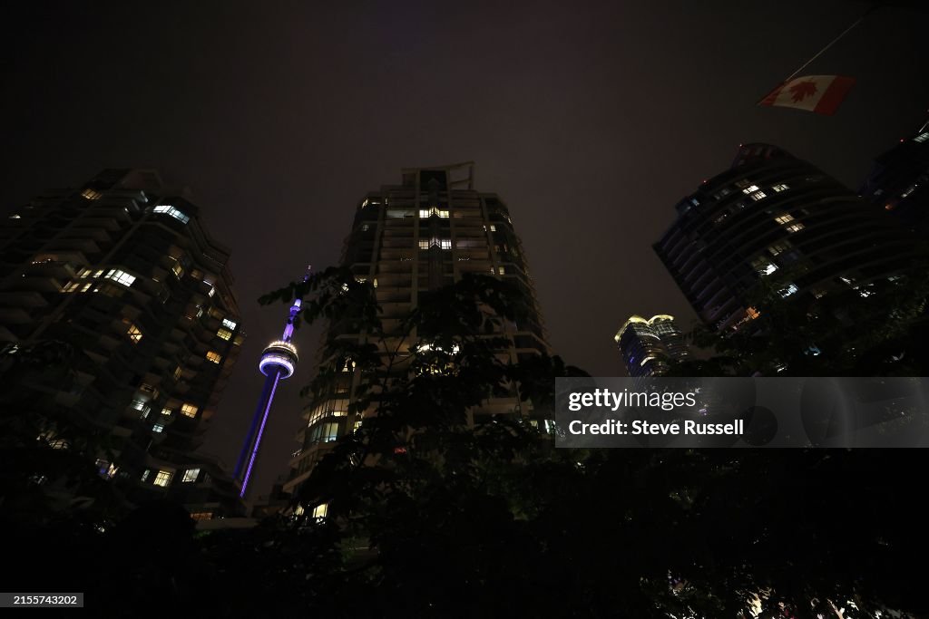 The CN Tower at night shines purple to draw attention to Spinal CSF Leak Awareness Week and Hidradenitis Suppurativa (HS) Awareness Week