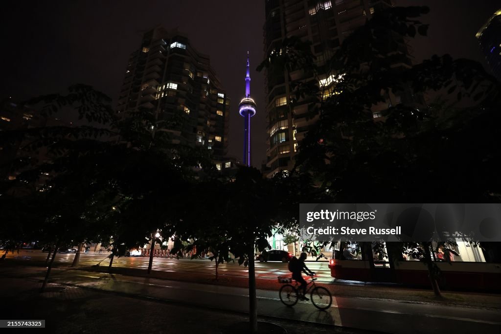 The CN Tower at night shines purple to draw attention to Spinal CSF Leak Awareness Week and Hidradenitis Suppurativa (HS) Awareness Week