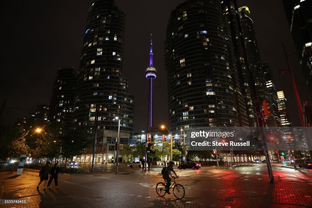 The CN Tower at night shines purple to draw attention to Spinal CSF Leak Awareness Week and Hidradenitis Suppurativa (HS) Awareness Week