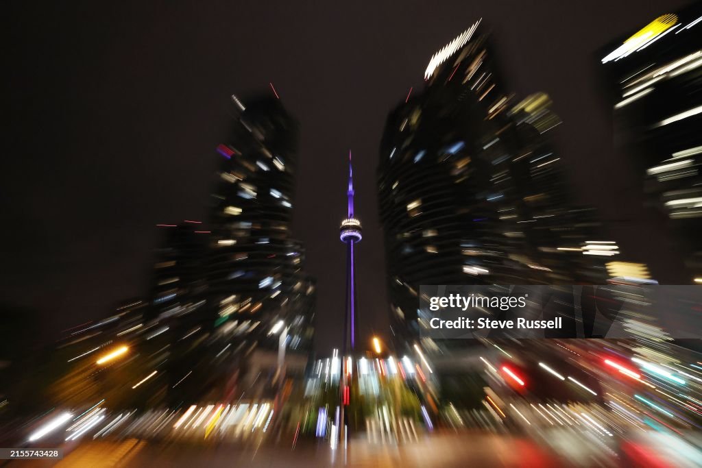 The CN Tower at night shines purple to draw attention to Spinal CSF Leak Awareness Week and Hidradenitis Suppurativa (HS) Awareness Week