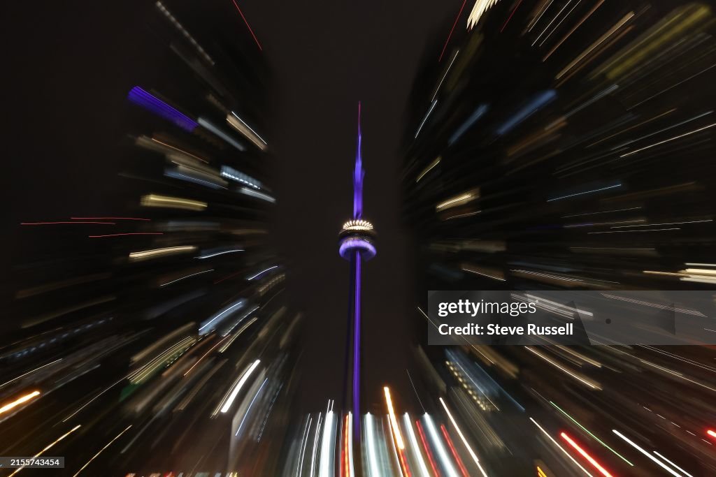 The CN Tower at night shines purple to draw attention to Spinal CSF Leak Awareness Week and Hidradenitis Suppurativa (HS) Awareness Week