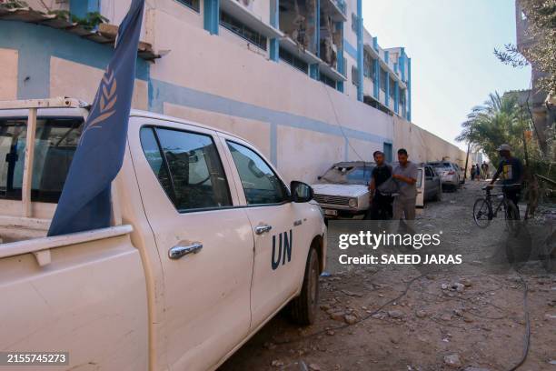 Picture shows a UN car near a UN-run school housing displaced people in Nuseirat, in the central Gaza Strip, on June 6 which was hit during Israeli...