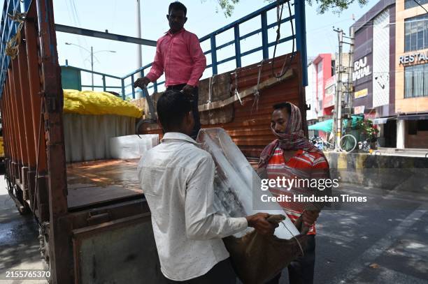 Workers supplying ice blocks during hot summer days at Old Railway Road near New Colony Mode; demand for ice blocks has increased in the last few...