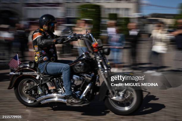Motorcyle rider takes part in a parade of 250 Harley-Davidson motorbikes organised by the association 'Ducs de Normandie Chapter France' through...