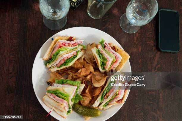 triple decker club sandwich at restaurant - club sandwich stockfoto's en -beelden