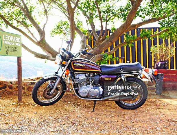 vintage 1976 honda cb750 four k parked at wine farm north of cape town, south africa - old car side view stock pictures, royalty-free photos & images
