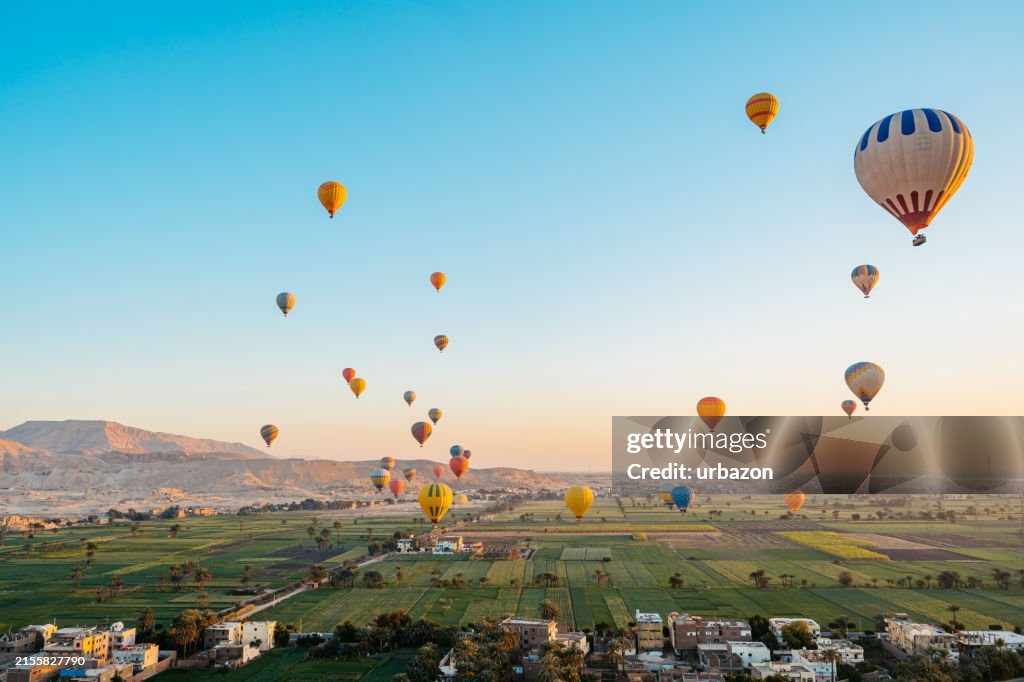 Hot Air Balloons Flying Mid-Air In Luxor In Egypt