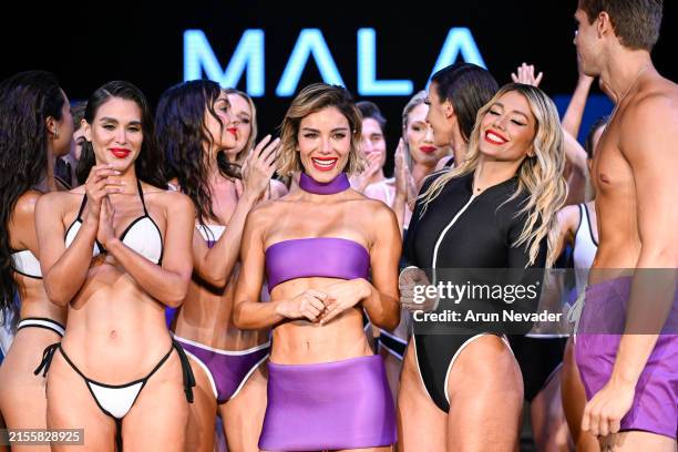 Designer Aleska Genesis and the models pose at the finale of the runway for the Mala X Sense Of G fashion show during the Miami Swim Week Powered By...