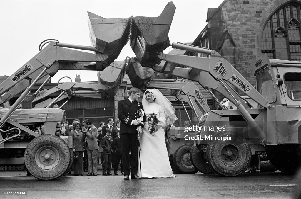 Four Diggers Four huge earth diggers raise their shovels in salute as Pat Commons ...