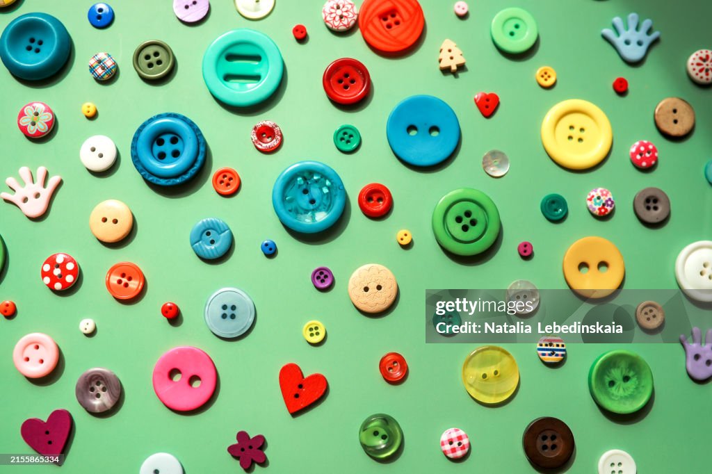 Spectrum of Selection: Multicolored Buttons on Green