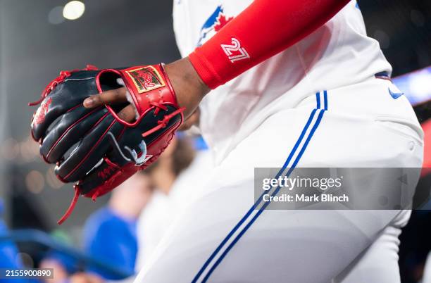 The glove of Vladimir Guerrero Jr. #27 of the Toronto Blue Jays is seen as he takes the field before playing the Pittsburgh Pirates in their MLB game...