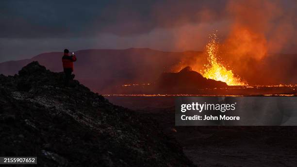 Photographer documents spewing lava from the Sundhnúkur volcano on June 2, 2024 on the Reykjanes peninsula near Grindavik, Iceland. The volcano,...