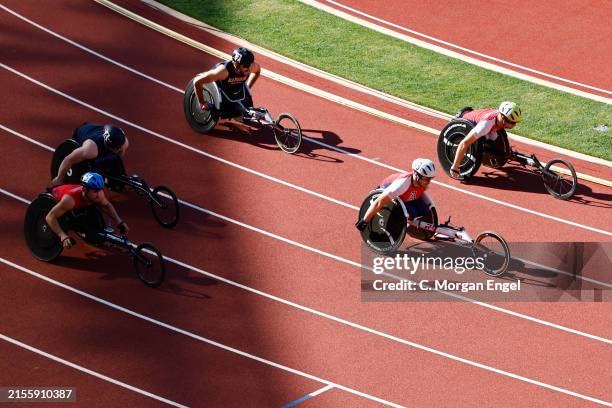 Athletes compete in the National Collegiate Wheelchair 100 meter during the Division I Men's and Women's Outdoor Track and Field Championship held at...