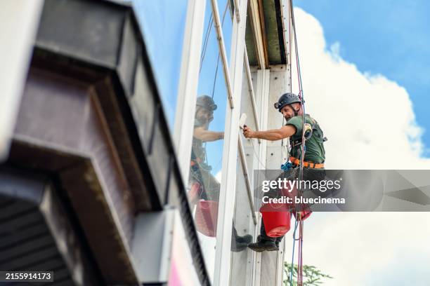 window washer - tinted window stock pictures, royalty-free photos & images