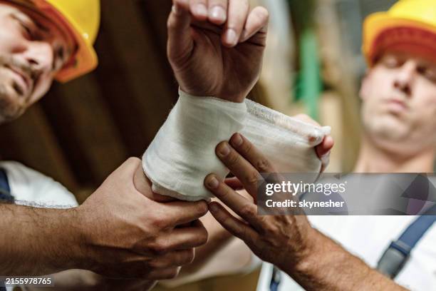 taking care of physical injury at work! - hand bandages stock pictures, royalty-free photos & images