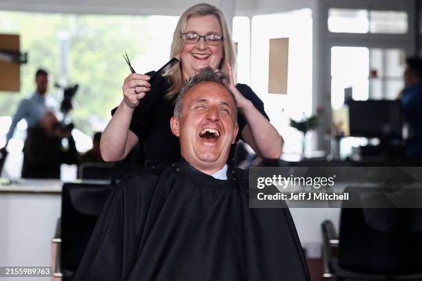 Scottish Liberal Democrat leader Alex-Cole Hamilton visits a hairdressing salon on June 04, 2024 in Edinburgh, Scotland. The Scottish Lib Dem leader...