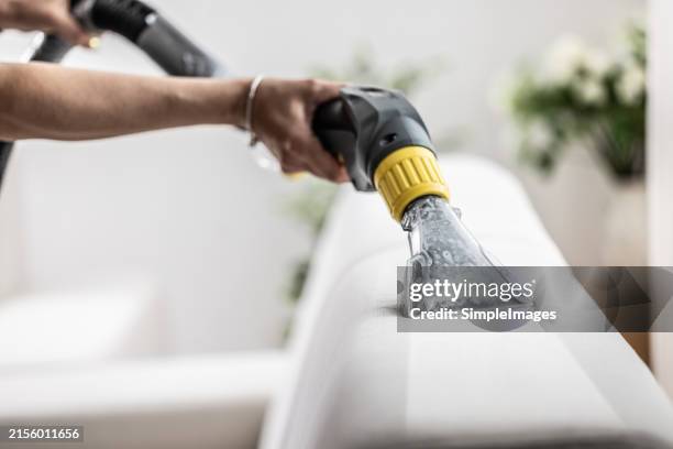 before and after deep cleaning of the sofa with a cleaning device. - aspiradora-artículo-de-limpieza fotografías e imágenes de stock