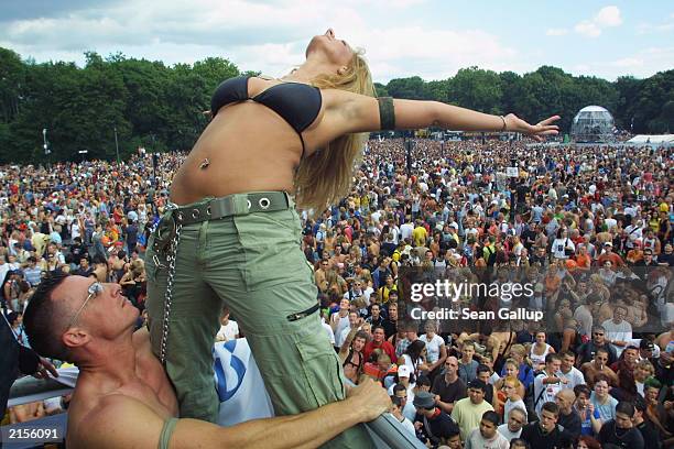 Couple dance on top of a truck blaring techno music to thousands of ravers July 12, 2003 at the annual Loveparade in Berlin, Germany. Hundreds of...