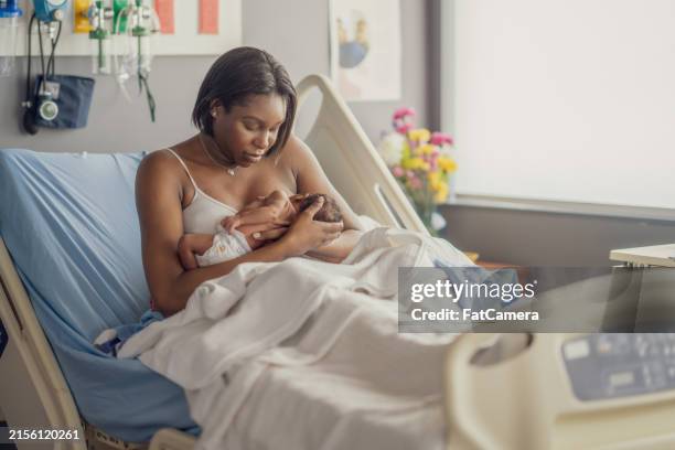 nursing baby - childbirth stock pictures, royalty-free photos & images