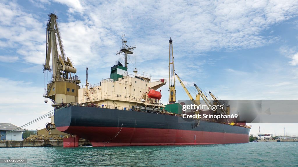 Container ship at main port It represents the backbone of shipping and the important role the maritime industry plays in global trade and logistics.