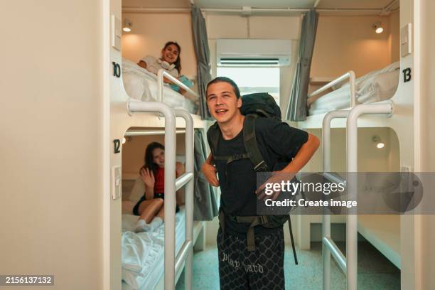 group of friend or tourist arriving with bunk beds in hostel. tourism and hotel business concept. - rucksacktourist stock-fotos und bilder