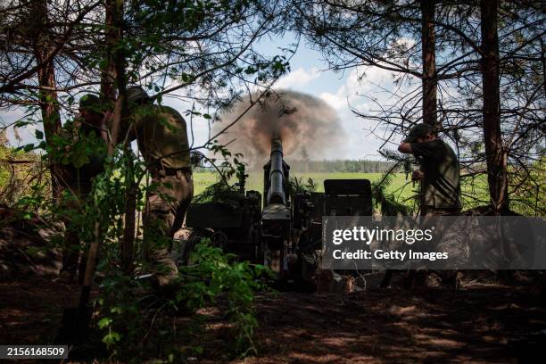 Ukrainian soldiers with the 57th Motorized Brigade operate at an artillery position on June 9, 2024 near Vovchansk, Kharkiv Region, Ukraine. Russian...