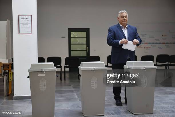 Hungarian Prime Minister Viktor Orban exits a polling booth to cast his ballot at a polling station located in a school in Budapest during the...