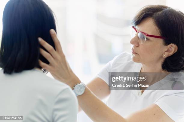 doctor's examination - stock photo - biopsia imagens e fotografias de stock