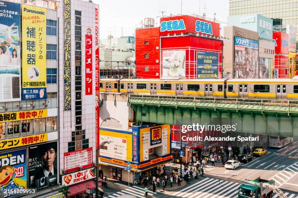 akihabara district with computer video games stores and advertisement, tokyo, japan - akihabara stock pictures, royalty-free photos & images