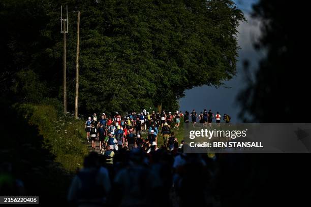 Runners compete in the Centurion South Downs Way 100 ultramarathon, in Winchester, south west of London on June 8, 2024. The Centurion South Downs...