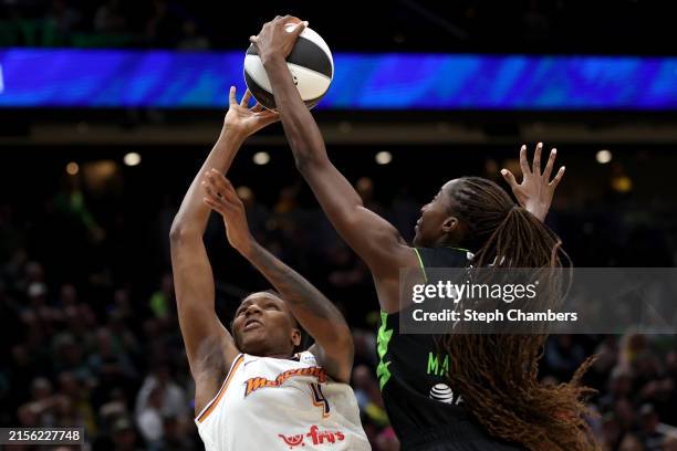 Ezi Magbegor of the Seattle Storm blocks the shot of Natasha Mack of the Phoenix Mercury during the first quarter at Climate Pledge Arena on June 04,...