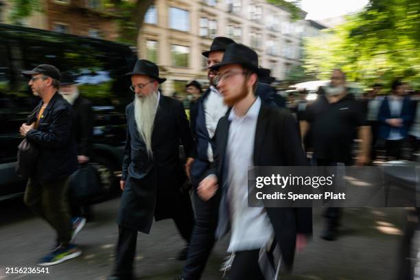 Orthodox mourners follow the casket of Rabbi Moshe Kotlarsky of the Chabad-Lubavitch movement, who passed away on Tuesday at the age of 74 on June...