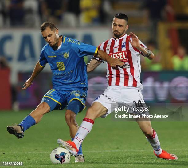 Mattia Finotto of Carrarese competes for the ball with Giuseppe Cuomo of Vicenza during the Serie C Playoff Final match between Vicenza and Carrarese...