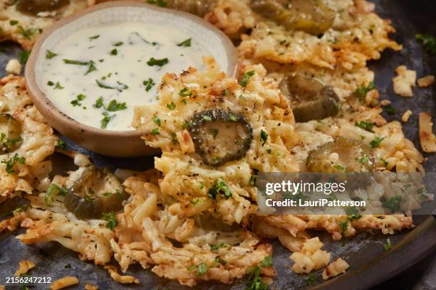 crispy parmesan dill pickle crisps - dill pickle stock pictures, royalty-free photos & images