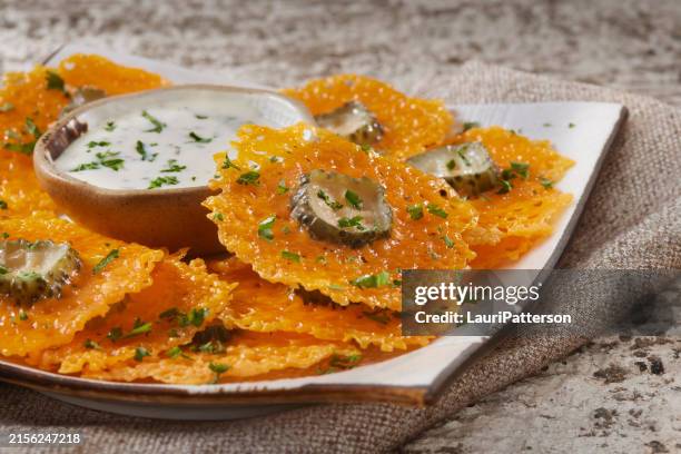 crispy cheddar cheese dill pickle chips - dill pickle stock pictures, royalty-free photos & images