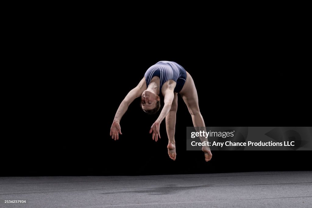 Summersault Female Gymnast Performing A Somersault Head On During Her Floor ...
