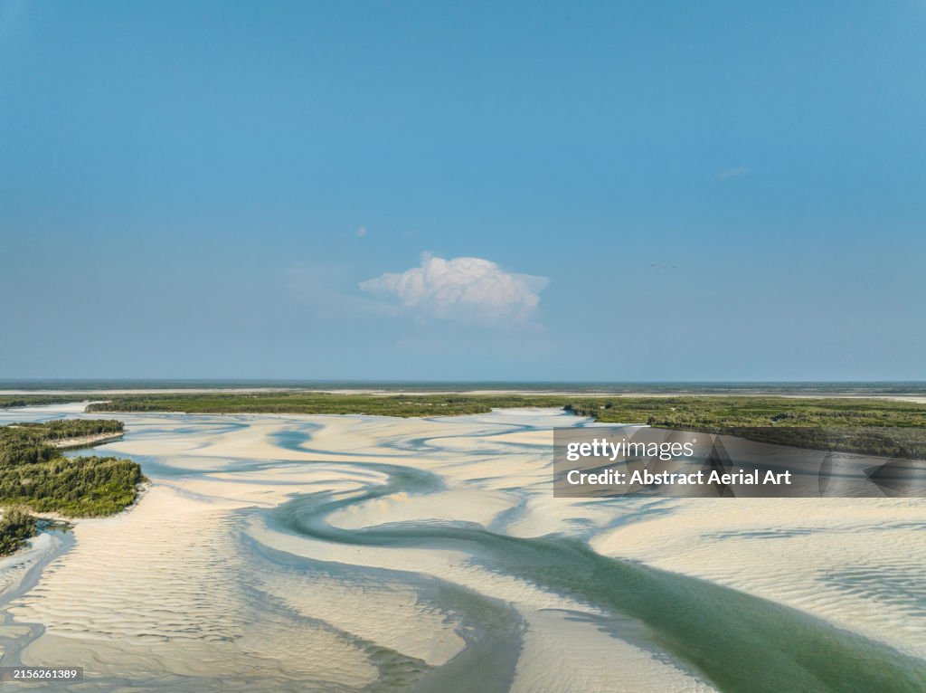 Willie Creek estuary at low tide photographed on a sunny day from an aerial point of view, The Kimberley, Western Australia, Australia