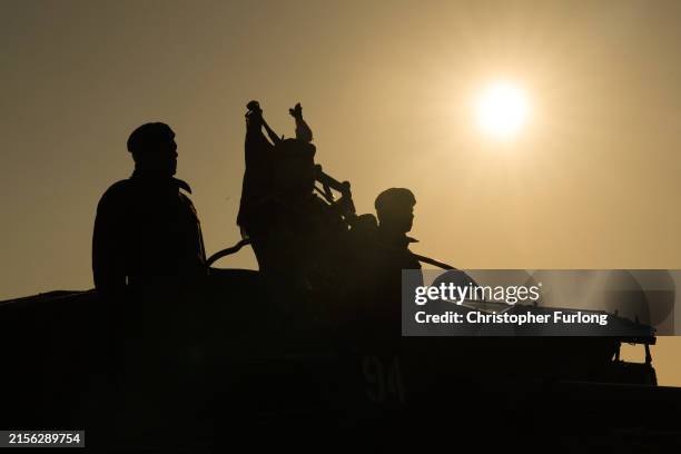 Pipe Major Trevor Macey-Lillie of the Scots Royal Artillery plays a lament as he arrives on Gold Beach in a WWII landing craft at 0726, the exact...
