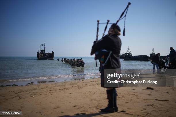 Royal Marines of 47 Commando land at Gold Beach to mark the 80th anniversary of the D-Day landing on June 06, 2024 in Asnelles, France. June 6th is...