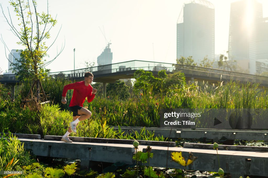 Running Environments Man Running In Urban Park Environment High-Res Stock Photo - Getty Images