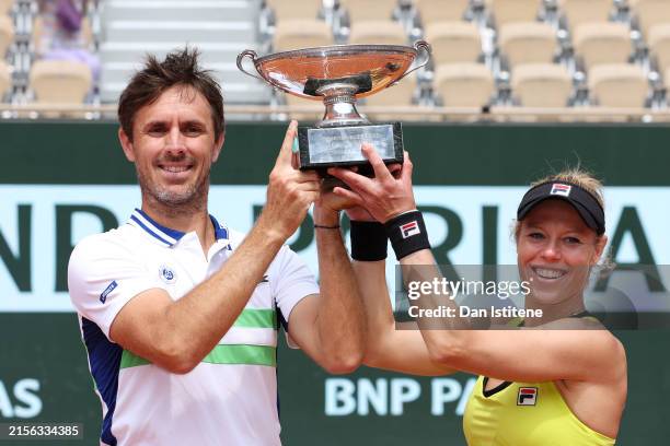 Laura Siegemund of Germany and Edouard Roger-Vasselin of France pose for a photo with their trophies after victory against Neal Skupski of Great...