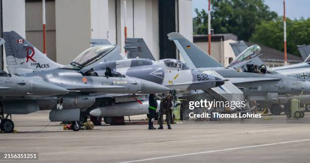 Fighter planes stand in front of a hanger at Ramstein Air Base during a day of fighter plane exercises on June 06, 2024 in Ramstein-Miesenbach,...