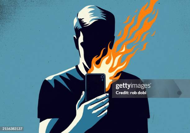 illustration of person holding phone with flames emanating - misinformation stock pictures, royalty-free photos & images
