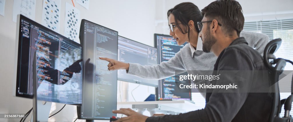 Hispanic Latin American couple, software engineer developer use computer, work on program coding together at home office. Programming language development technology, freelance job concept