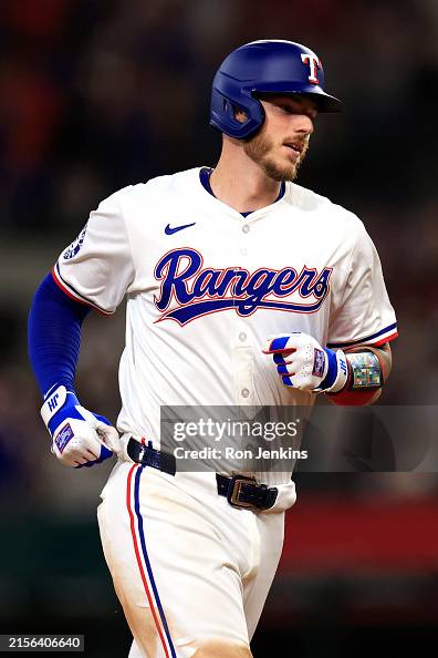 Texas Ranger Heim Jonah Heim of the Texas Rangers runs the bases after hitting a two ...