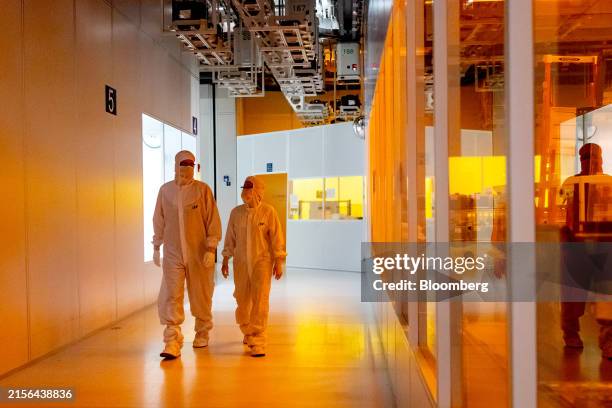 Workers in the building 51 fab clean room area at Micron Technology Inc. Headquarters in Boise, Idaho, US, on Monday, June 10, 2024. The US announced...